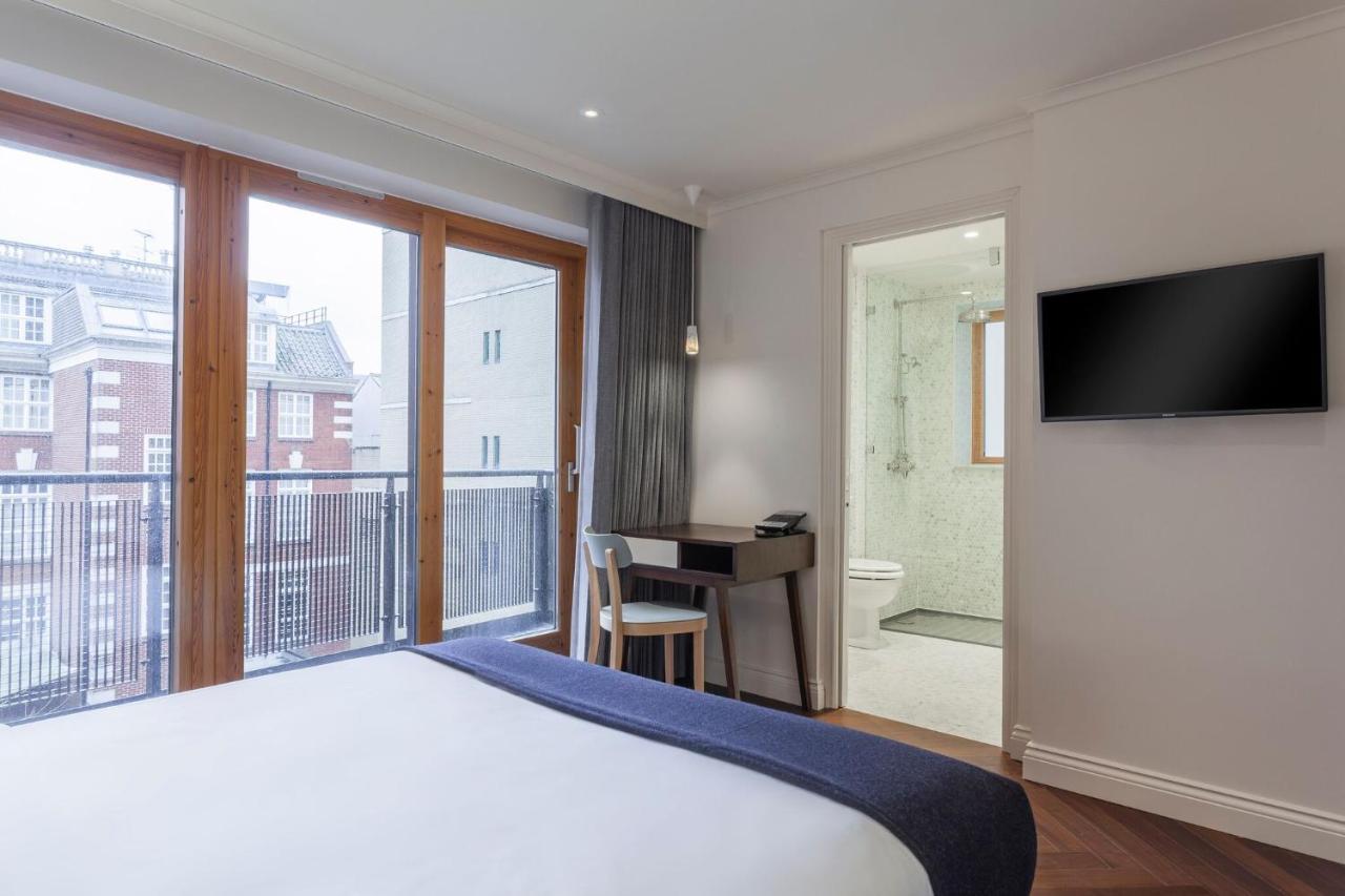 Отель The Roseate Ридинг Экстерьер фото A room at the hotel